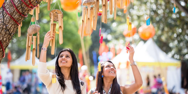Two friends enjoying the decorations at parramasala festival in parramatta 2013
